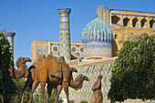 Statue of man leading camels, Registan ensemble, Samarkand, Uzbekistan