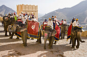 Mahouts and tourists riding on elephants, Amber Palace, Amber, near Jaipur, Rajasthan, India