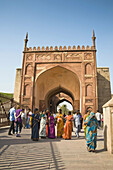 Tourists outside one of the gates at Agra Fort, also known as Red Fort, Agra, Uttar Pradesh, India