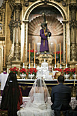 Wedding ceremony in front of the statue of Jesus del Gran Poder, Seville. Andalusia, Spain