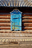 Russia. Tarbagatai Villlage of Old Believers of original Russian Orthodox. Colorful window treatment