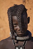 Himba boy with the typical double plait hairstyle, Kaokoland, Namibia