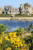 France, Brittany, Plougrescant 22  Coastal house at Castel Meur, ´Maison du Gouffre´ between two rocks