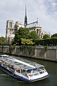France, Paris 75  Notre Dame cathedral and tourist boat on the Seine river