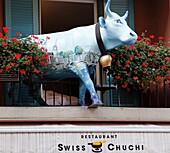 Switzerland, Zurich, Swiss cow statue restaurant sign