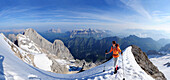 Woman ascending Marmolada, Dolomites, Trentino-Alto Adige/Südtirol, Italy
