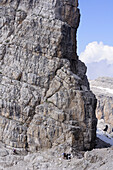 Group of mountaineers standing at the start of a fixed rope route, Bocchette way, Brenta mountain range, Dolomites, UNESCO World Heritage Site, Trentino, Italy