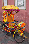 Decorated Rickshaw in the historical center of Malacca, Malaysia, Asia.