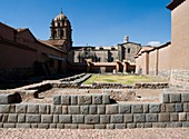 Peru. Cusco city. Ruins of Kusicancha and the Church of Santo Domingo.