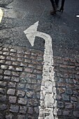 arrow, asphalt, cobble, cobblestone, Color image, concept, corner, day, direction, obligation, outdoor, pavement, paving stone, road sign, sign, street, symbol, Traffic sign, transport, turn, turning, vertical, view from above, Viewed from above, B75-9758
