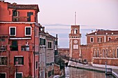 canal and in the back ground 1 of the entrance towers opening on to the Arsenal, Venice Italy