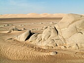 Namibia - Grey-white rocks and sand dunes in the Namib Desert at Torra Bay Skeleton Coast Park, Namibia