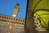 Palazzo Vecchio and TheRape of the Sabines,  (1579_83), freestanding sculpture by Giambologna at Loggia dei Lanzi. Piazza della Signoria, Florence, Tuscany, Italy