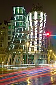 prague, czech republic - the dancing house and traffic in rain