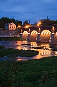 Latvia, Western Latvia, Kurzeme Region, Kuldiga, bridge over the Venta River by the Ventas Rumba, Kuldiga Waterfall, Europe's widest falls, width 275 meters, evening