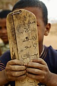 Coranic tablet, nomad family near Chinguetti, Adrar Plateau, Sahara desert, Mauritania