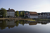 Timberframe houses reflected in the river Fulda, Rotenburg an der Fulda, Hesse, Germany, Europe