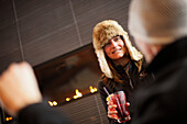 Woman with a drink in Cypress Creek Day Lodge, Cypress Provincial Park, British Columbia, Canada