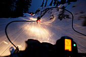 Snowmobiles on runway to mountain lodge Crystal Hut, Blackcomb Mountain, Whistler, British Columbia, Canada