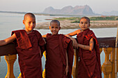 Three young buddhistic monks at the Shwe Yin Myaw Pagoda in Hpa-An, Kayin State, Myanmar, Birma, Asia