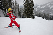 Girl on slope, skiing region at sport region Ifen, Hahnenkopfle-Bahn, Kleinwalsertal, Vorarlberg, Austria