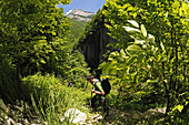 Hiker with rucksack in the country, Caramanico Terme, Orfento gorge, Maiella National Park, Abruzzi, Italy, Europe