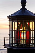 USA, Oregon, Tillamook County, Cape Meares State Park, Cape Meares lighthouse, Pacific ocean, sunset, August, vertical