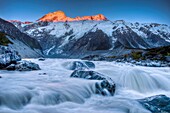 Mt Sefton at dawn, Hooker river flows from Mueller glacier, Mount Cook National Park, Canterbury, New Zealand