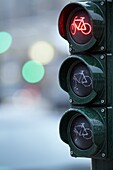 Close-up of traffic light for bicyclists, showing red light at an intersection with blurred background, Hamburg, Germany, Europe