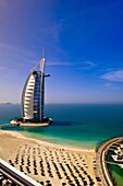 The beach of the Jumeirah Beach Hotel with the Burj Al Arab Hotel in background, Dubai, United Arab Emirates