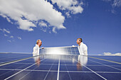 Technicians installing a photovoltaic power plant, Hamburg, Germany