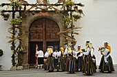 Group of women in canrian traditional costume in front of the church portal at Los Realejos, Romeria, Tenerife, Canary Islands, Spain