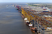 Aerial view of a container port with loading cranes, terminal and freight ships, Bremerhaven, Bremen, Germany