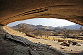 Rock shelter Phillipp´s Cave with view over savannah, Ameib, Erongo mountains, Namibia