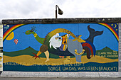 The East Side Gallery along Mühlenstrasse, the longest preserved piece of Berlin Wall, with 1.3 kilometres length the longest open air gallery of the world, Berlin Wall Trail, Friedrichshain, Berlin, Germay, Europe
