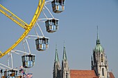 Ferris wheel infront St. Peters Church in Munich