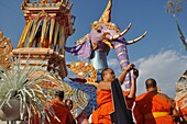 Chiang Mai (Thailand): monks at the Wat Phra Singh during another important monk's funeral, at the bottom of an elephant shaped pyre