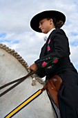 Andalusian young girl riding a horse