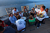 Waiter serving drinks, cafe bar, Zakerjan Tower, Korcula town, Korcula, Dubrovnik-Neretva County, Dalmatia, Croatia