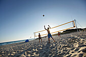 Men playing beach volleyball, Formentera, Balearic Islands, Spain