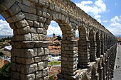 Roman aqueduct of Segovia, Patrimony of the Humanity by UNESCO, with a stork in the high part