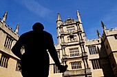 The Old Bodleian Library, with Silhouetted Statue of the Earl of Pembroke, Oxford, England, UK
