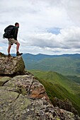 Pemigewasset Wilderness - A hiker on the summit of Bondcliff during the summer months Located in the White Mountains, New Hampshire USA
