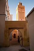 Minaret of Uqba and Moroccan women chatting, Oujda, Oriental region, Morocco