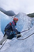 Climber climb Nigardsbreen glacier National Park of Jostedalbreen Norway