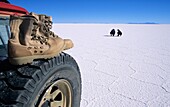 Boots over wheel Salar de Uyuni Potosi Bolivia