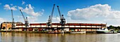 A panoramic view over Princes Wharf towards the cranes and buildings of the Bristol Industrial Museum, Bristol, England As part of the redevelopment of the Bristol docks, the museum is currently undergoing restoration and is due to reopen in 2011 as the