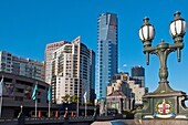 Melbourne skyline from Princes Bridge with city coat of arms on lamp standard
