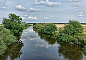 River Nordermiele running through the countryside, Meldorf, Dithmarschen, Schleswig-Holstein, Germany