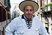 Cheerful gondolier, Gondolieri wearing traditional clothes, Venice, Veneto, Italy, Europe